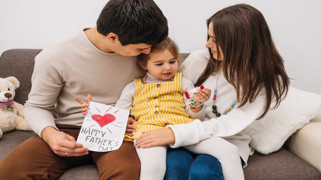 A wife giving her husband a thoughtful Father’s Day wish and card