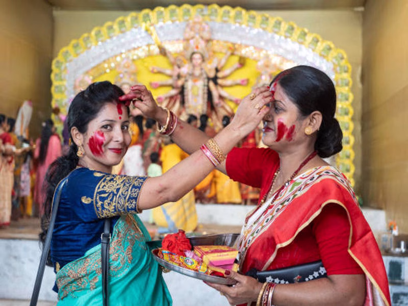 Two friends sharing laughs and Dussehra greetings