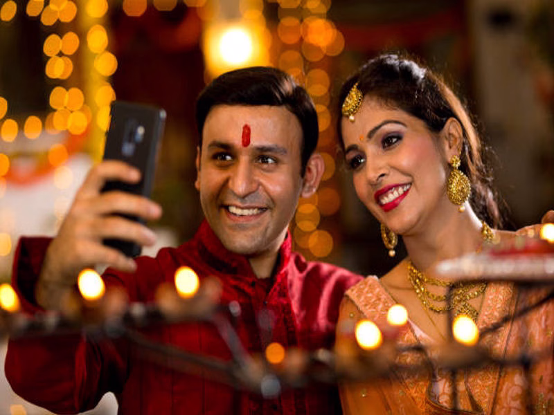 Couple celebrating Dussehra with candles and sweets