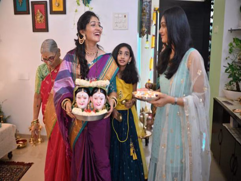 Family celebrating Dussehra with traditional clothes and smiles