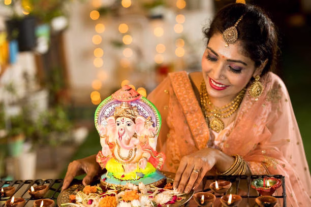 Happy Ganesh Chaturthi wishes with festive decoration and Lord Ganesha idol
